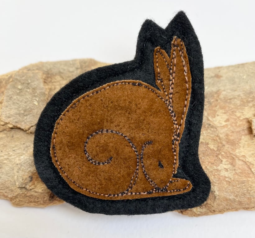 Upcycled sleeping hare brooch pin or badge. 