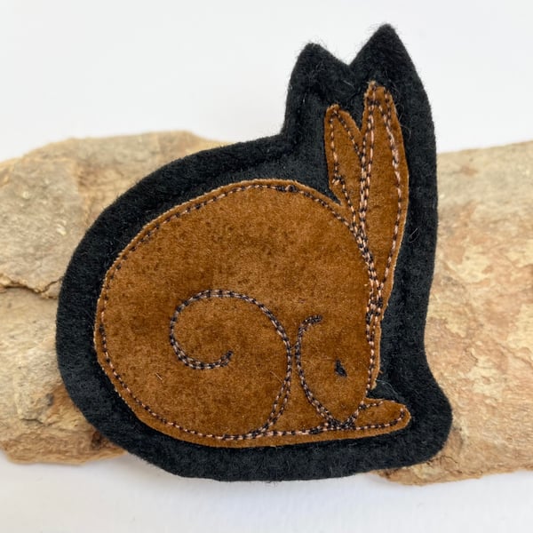Upcycled sleeping hare brooch pin or badge. 