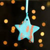 Turquoise and copper marbled ceramic star decoration 