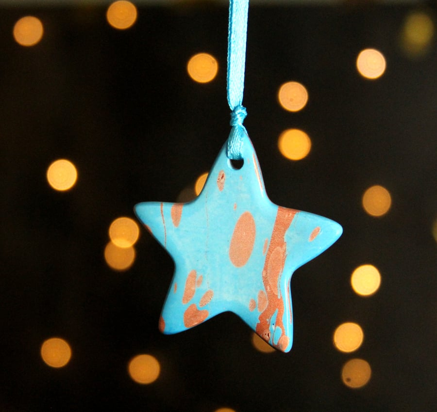 Turquoise and copper marbled ceramic star decoration 