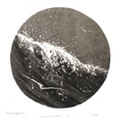 Sea, surf and gliding gulls black and white monoprint coastal beach scene