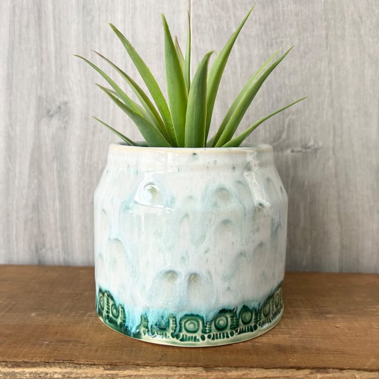 Ceramic hand thrown pot with white and green drippy glaze