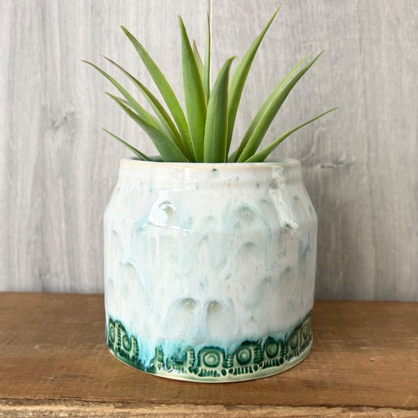 Ceramic hand thrown pot with white and green drippy glaze