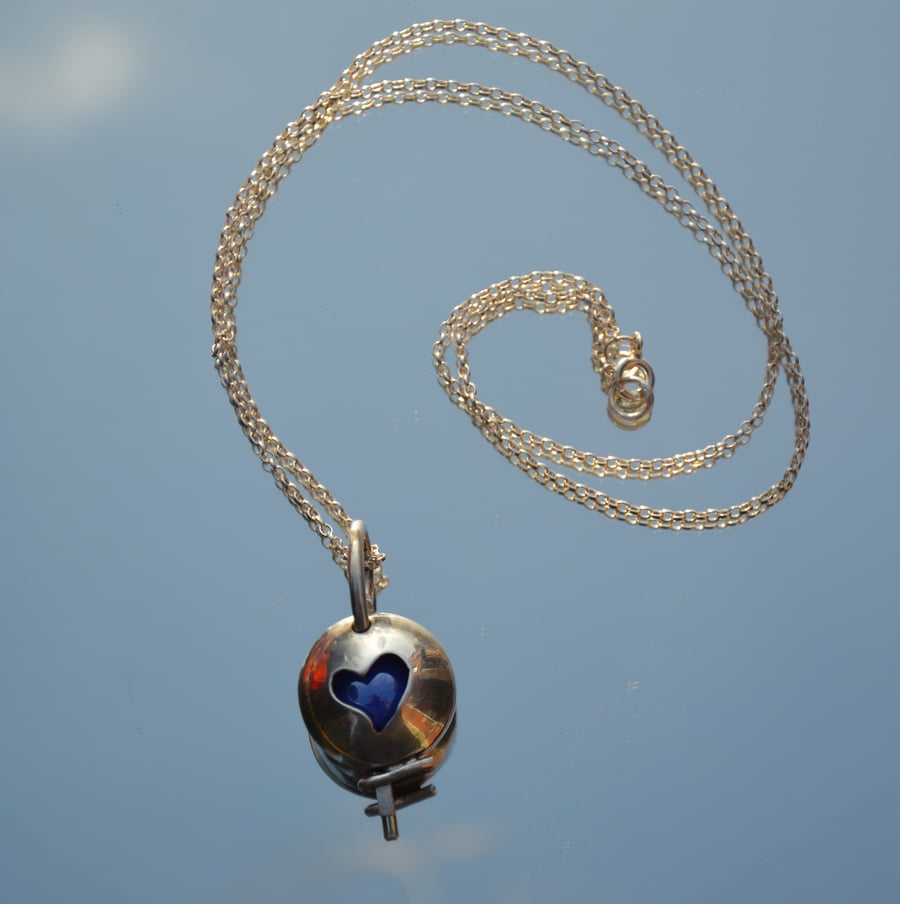 Sterling silver pendant locket with 5 different coloured marbles.