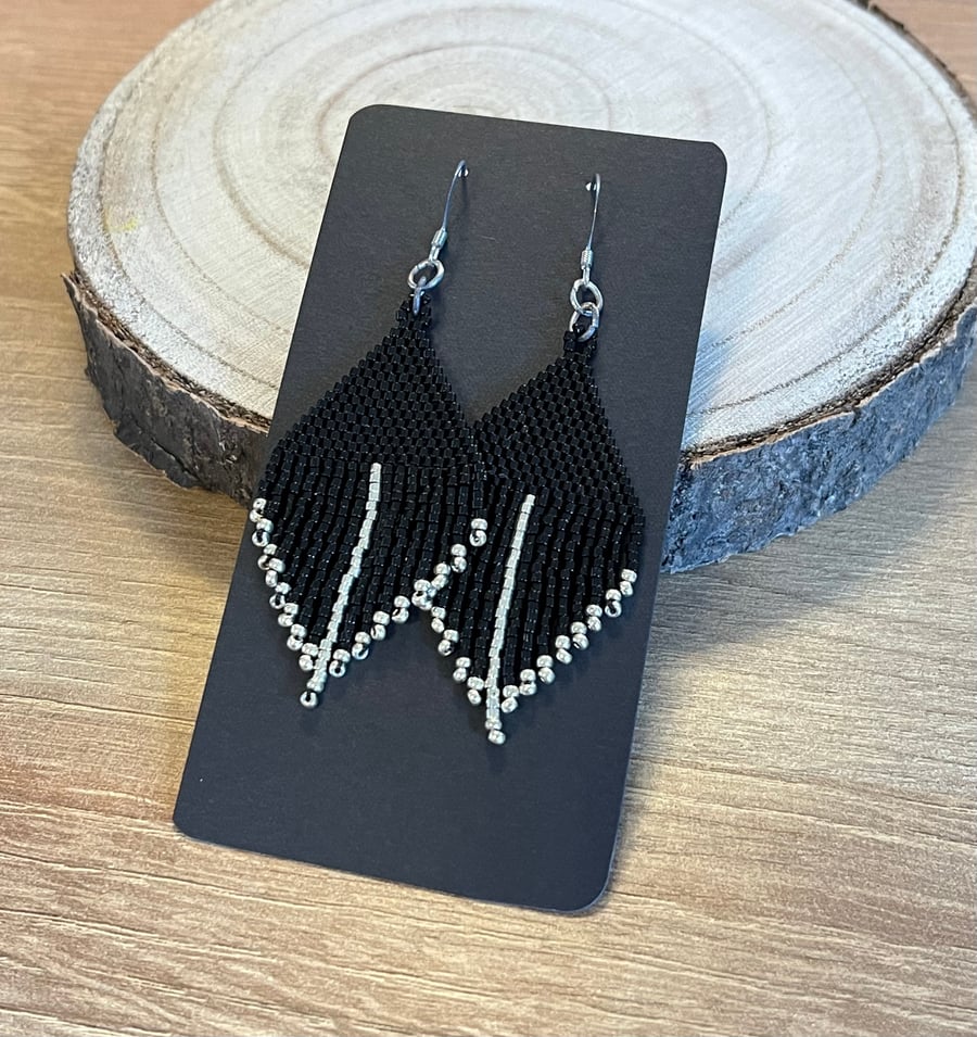 Shiny black and silver mini fringe beaded feather style earrings