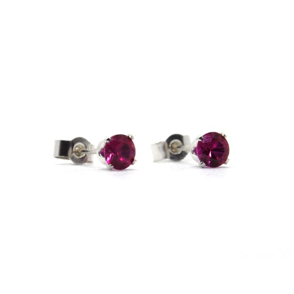 Red ruby stud earrings set in silver