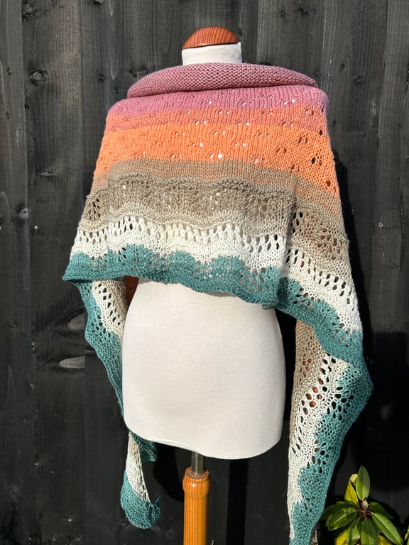 Unique hand knitted extremely shallow crescent wrap scarf in soft wool yarn cake