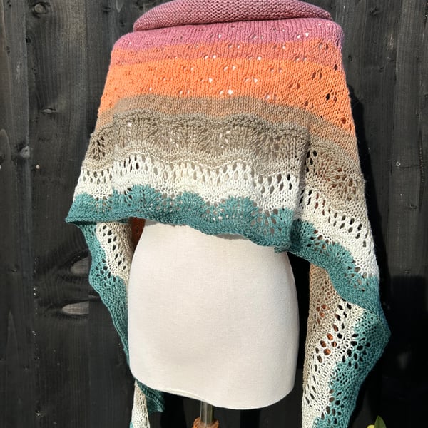 Unique hand knitted extremely shallow crescent wrap scarf in soft wool yarn cake