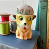 Pin cushion in a vintage dog egg cup embroidered flowers and bee