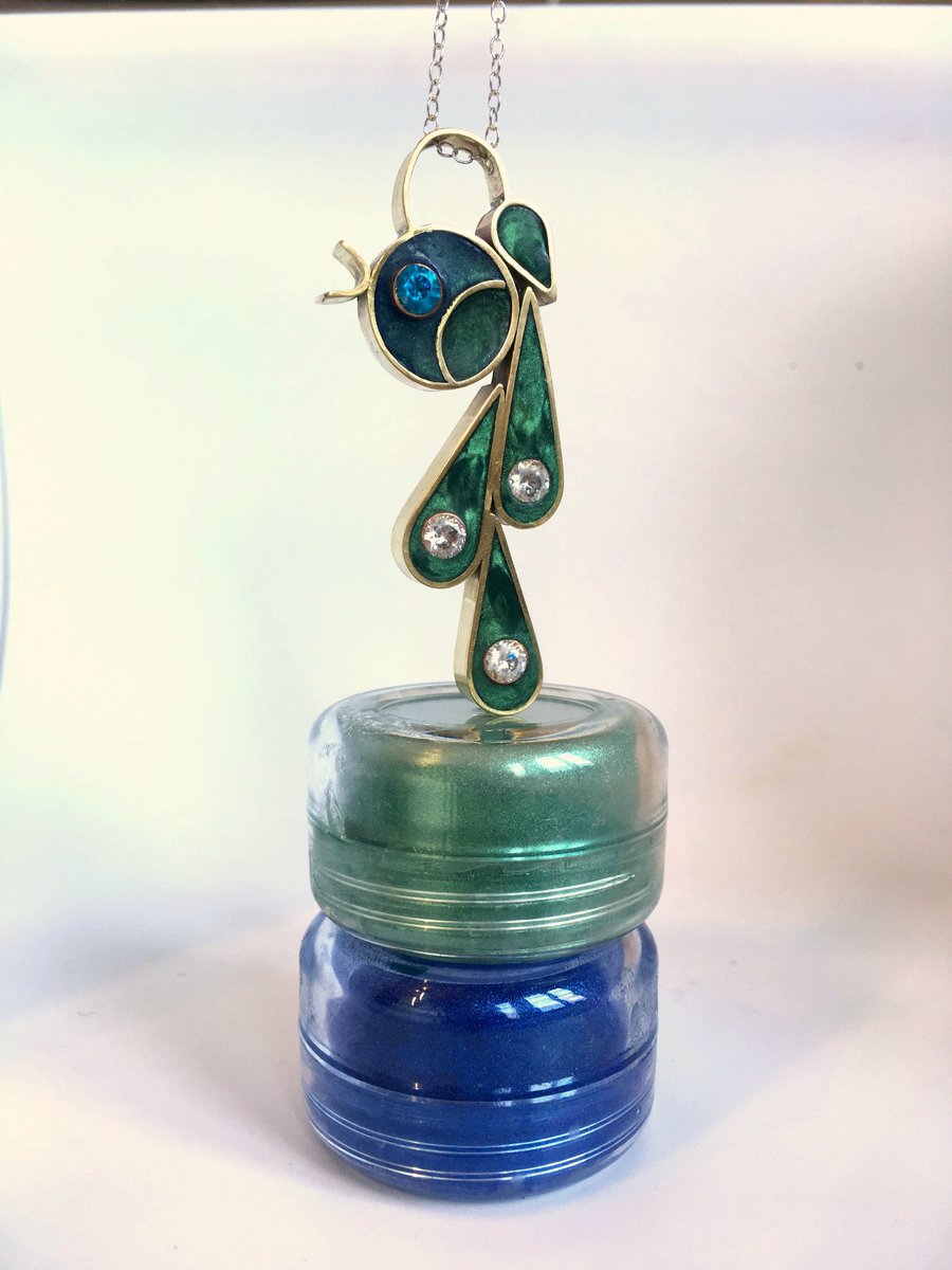 A statement pendant filled with resin enamel and 5 mm cubic zirconia 