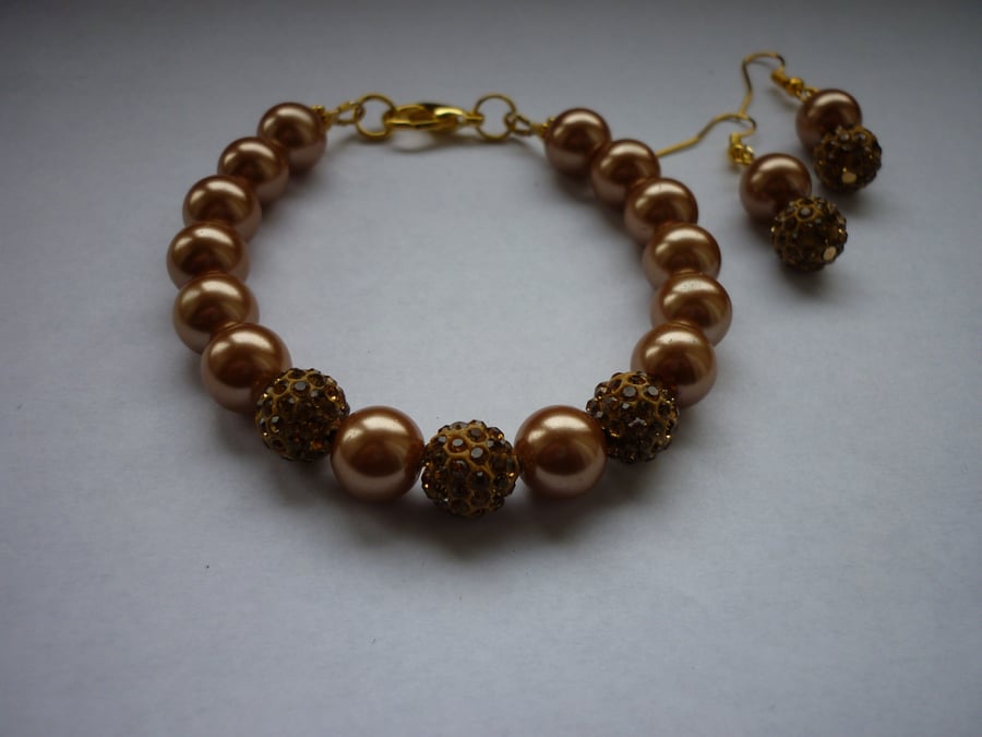 ANTIQUE BRONZE AND GOLD - PEARL AND PAVE BEADED BRACELET AND EARRING SET.