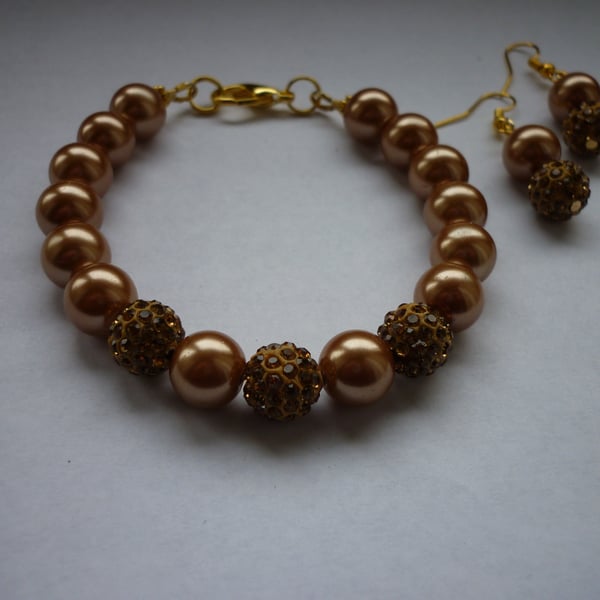 ANTIQUE BRONZE AND GOLD - PEARL AND PAVE BEADED BRACELET AND EARRING SET.