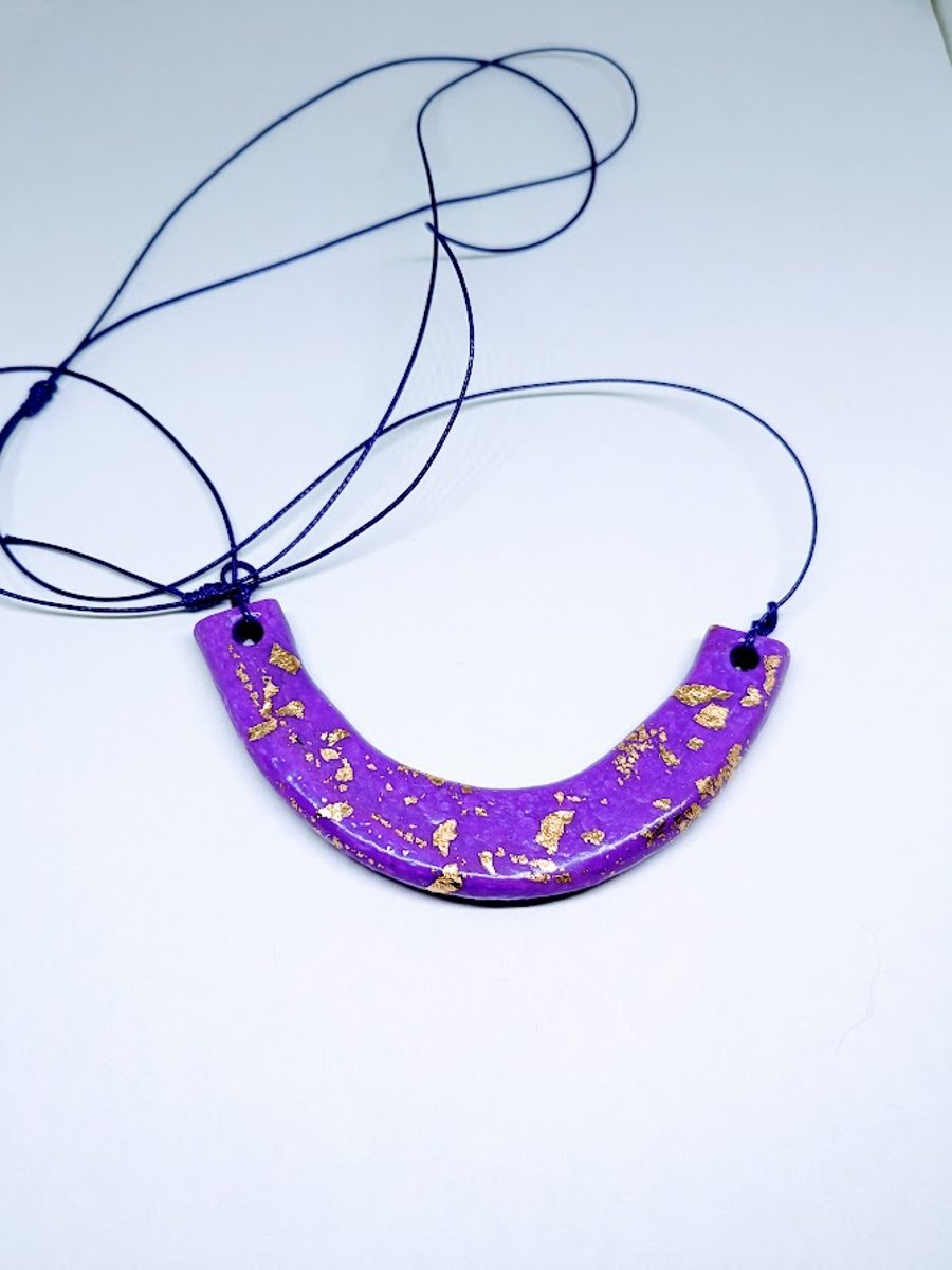 A fun modern polymer clay purple and gold necklace