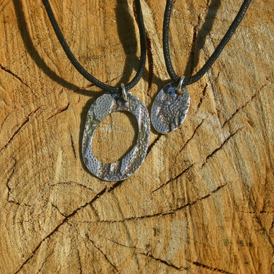 Daddy and son fine silver pendants on black cord