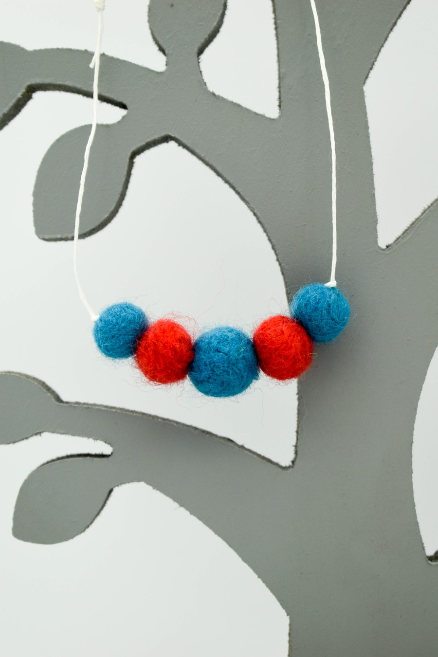 Felted bead necklace in red and blue wool