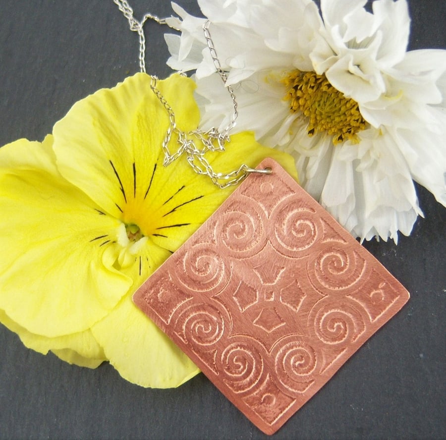 Statement pendant in etched copper