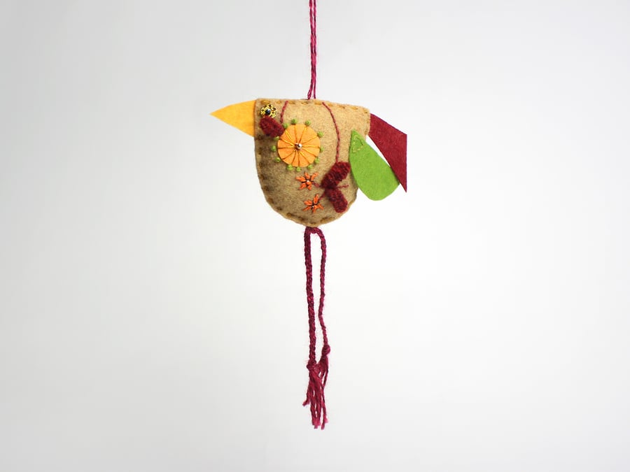 Hay coloured felt bird with hand embroidered body