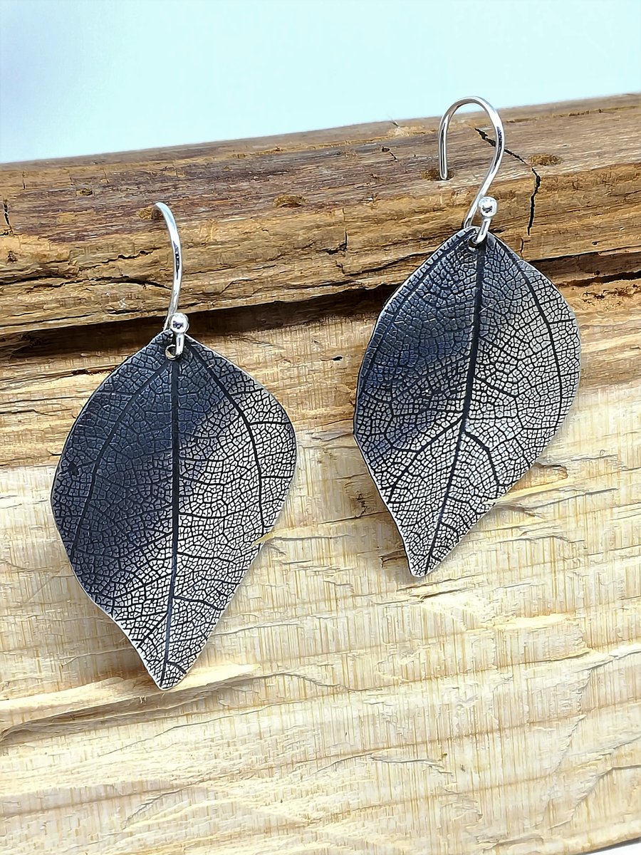 Sterling silver Leaf earrings , rolled with a dried leaf and oxidised 