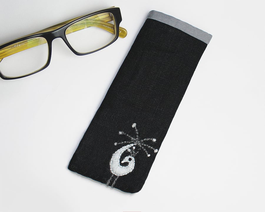 Black twill glasses case with monochrome wool peacock