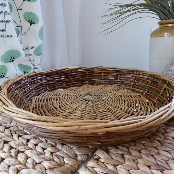 Handmade round willow basket with shallow sides