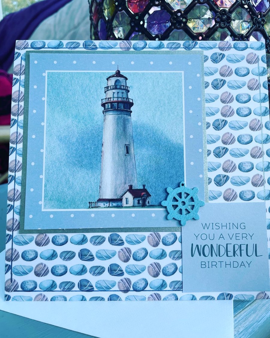 Lighthouse in a stormy sky happy birthday card