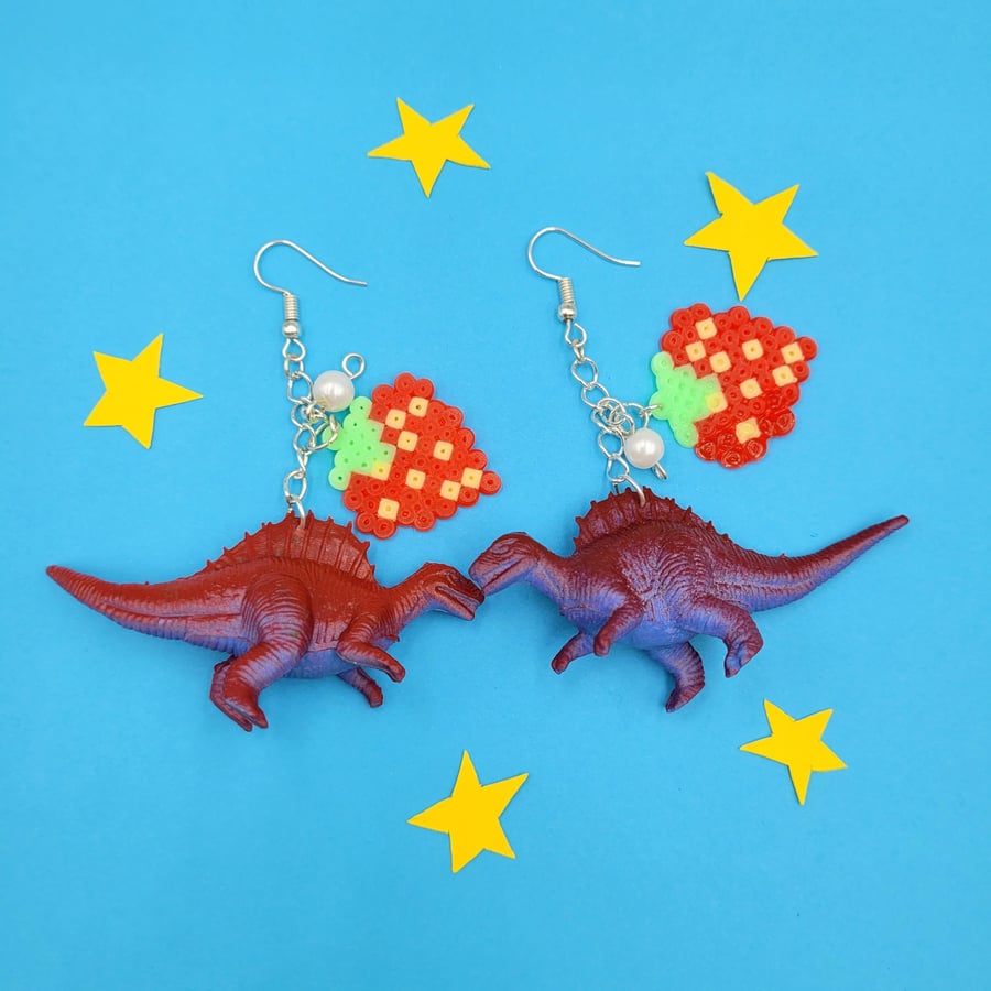 Handmade up-cycled dinosaur earrings with strawberry charms 