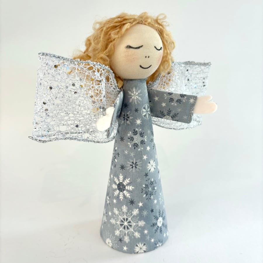 Contemporary silver grey Christmas tree topper angel with snowflake detail. 