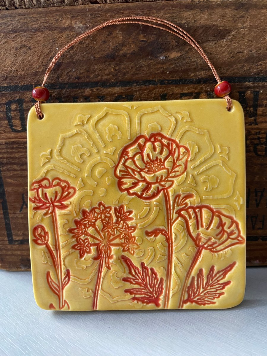 Retro style ceramic tile decoration in red and yellow