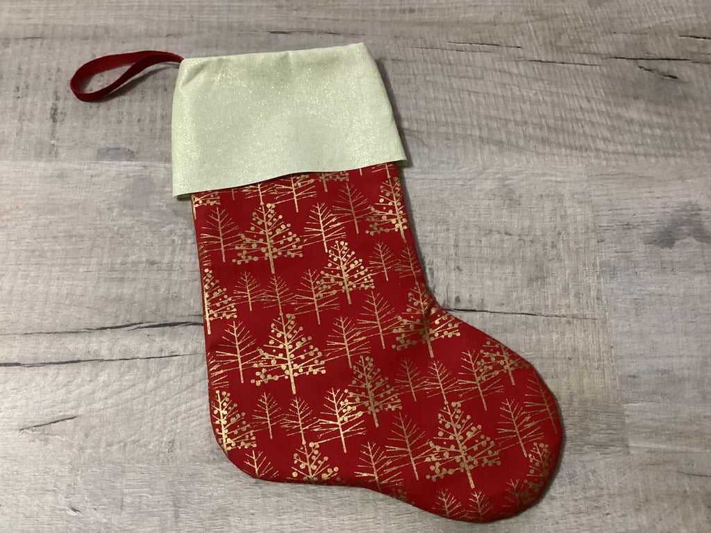 Christmas stocking in red and gold, Christmas trees.