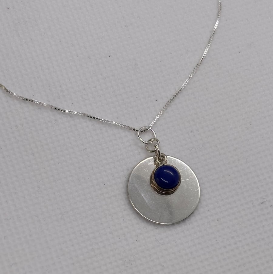 Silver disc pendant with lapis