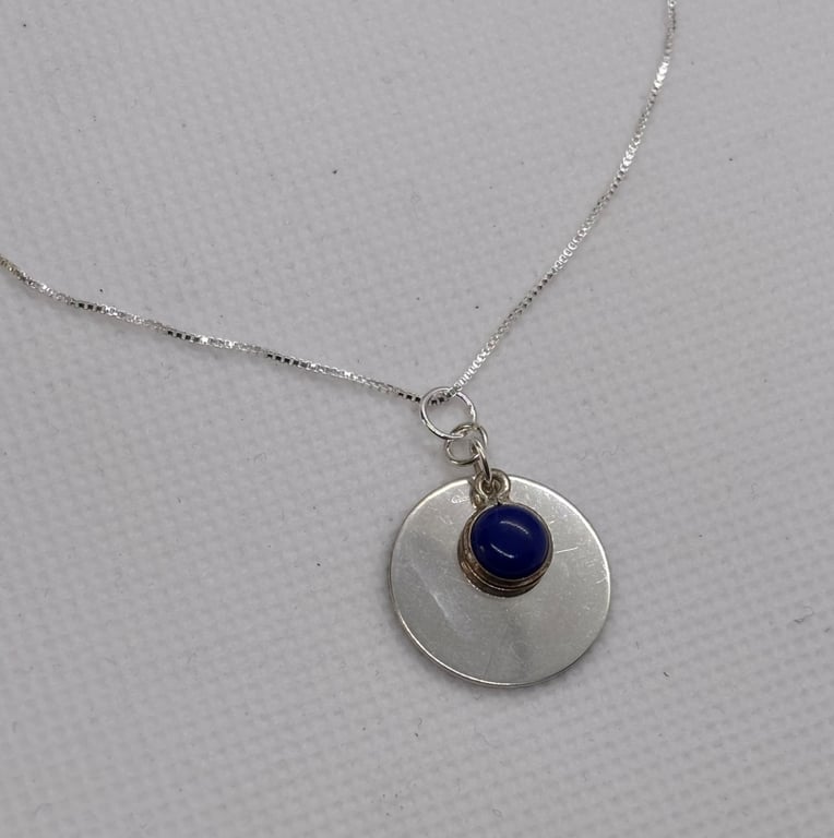 Silver disc pendant with lapis