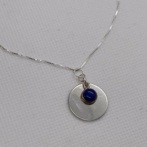 Silver disc pendant with lapis
