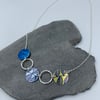 Blue and lime green leaf circle and recycled silver ring necklace