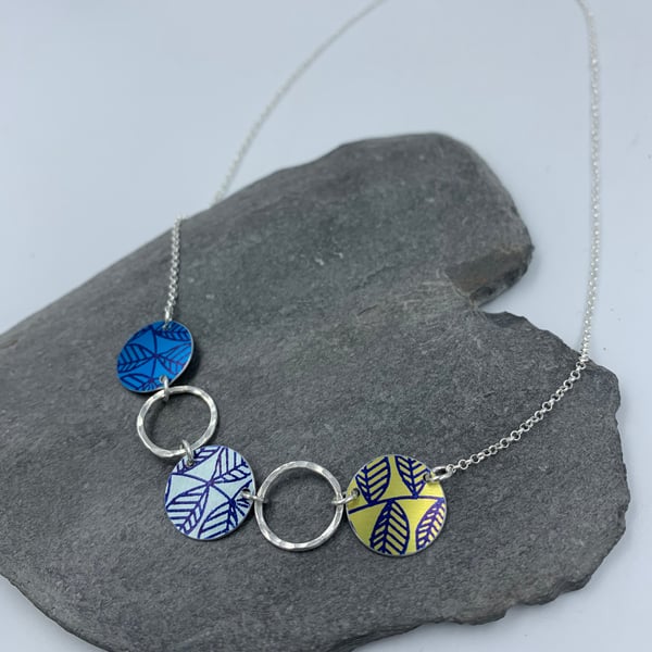 Blue and lime green leaf circle and recycled silver ring necklace