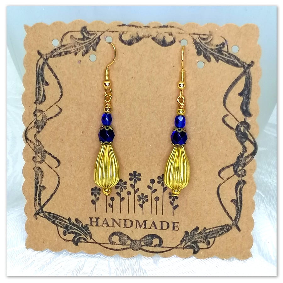 Elegant Gold-plated earrings with dark blue glass crystal beads