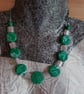 Handmade green and white polymer clay and glass necklace