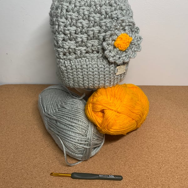 Crocheted flower appliqué hat