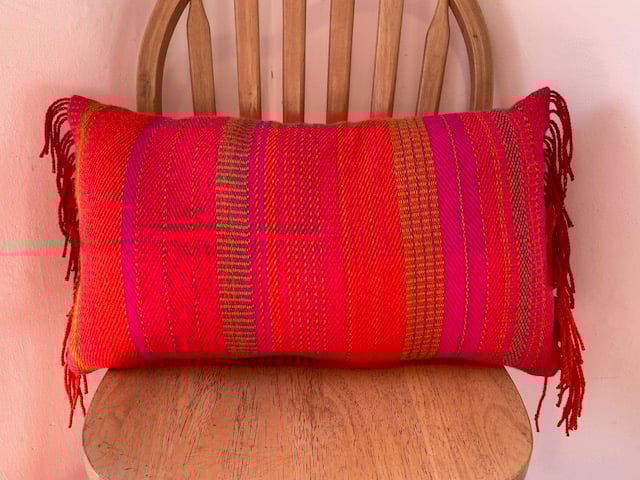   Rectangular shaped cushion with fringing detai, hand crafted from British wool