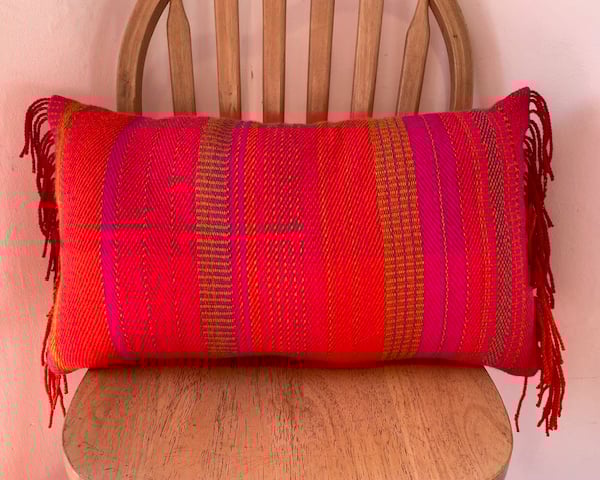   Rectangular shaped cushion with fringing detai, hand crafted from British wool