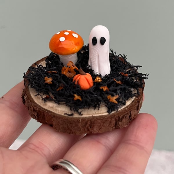 Pet ghost on a log slice 