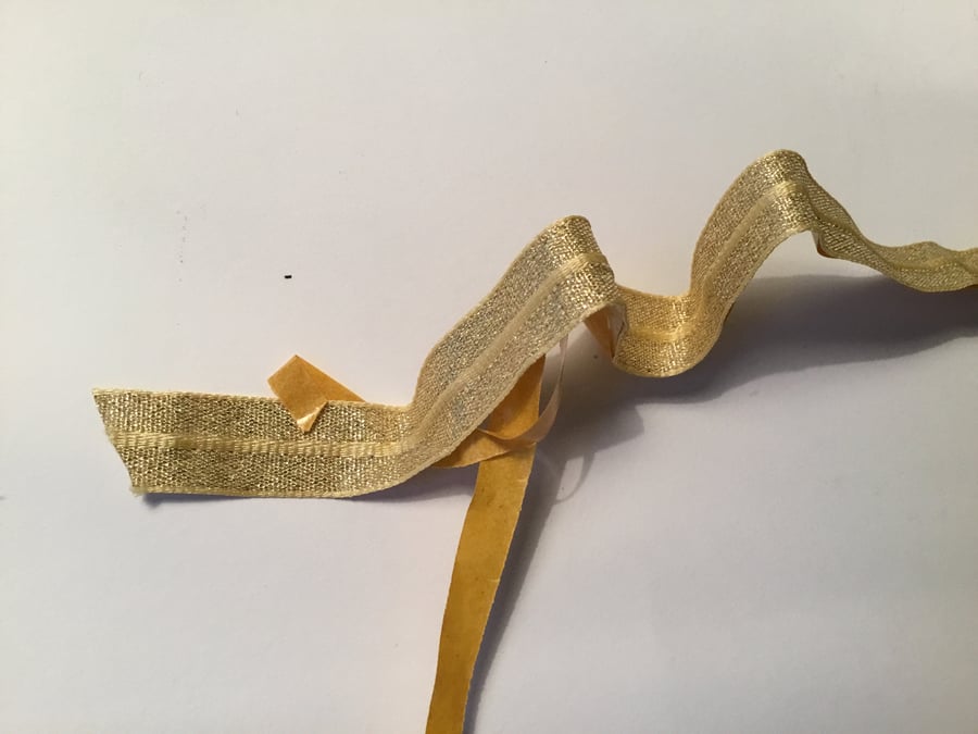 Gold ribbon trim - sticky back and wired edges. 