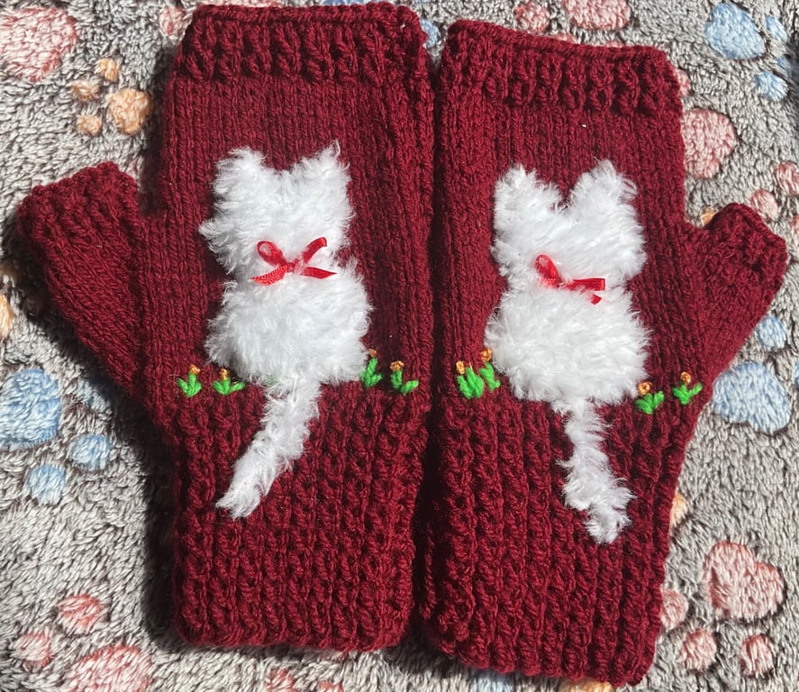 Soft pretty.  mittens with a fluffy white cat  on