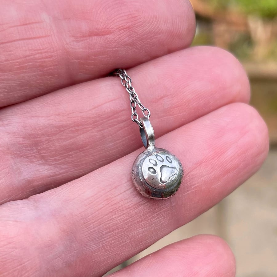 Sterling silver pendant with paw print on silver chain