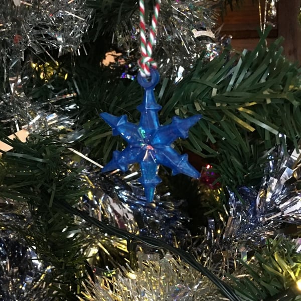 Blue snowflake Christmas tree decoration.