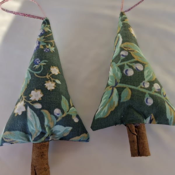 Pair of hand crafted fabric christmas tree decorations with cinnamon trunk