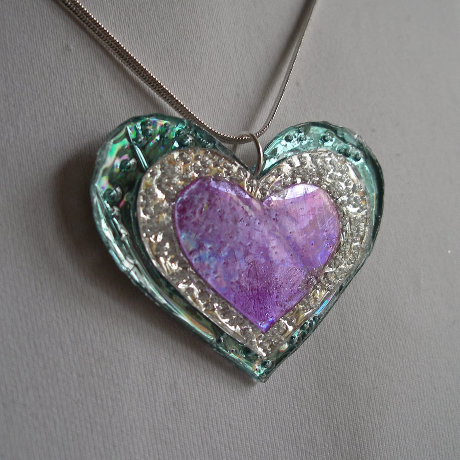 Colourful reflective heart pendant.