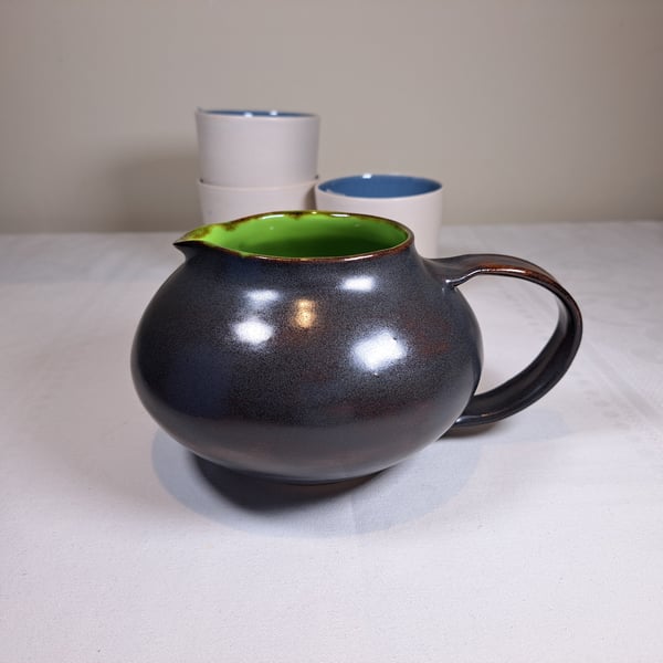 LIME GREEN CERAMIC JUG - with a charcoal exterior