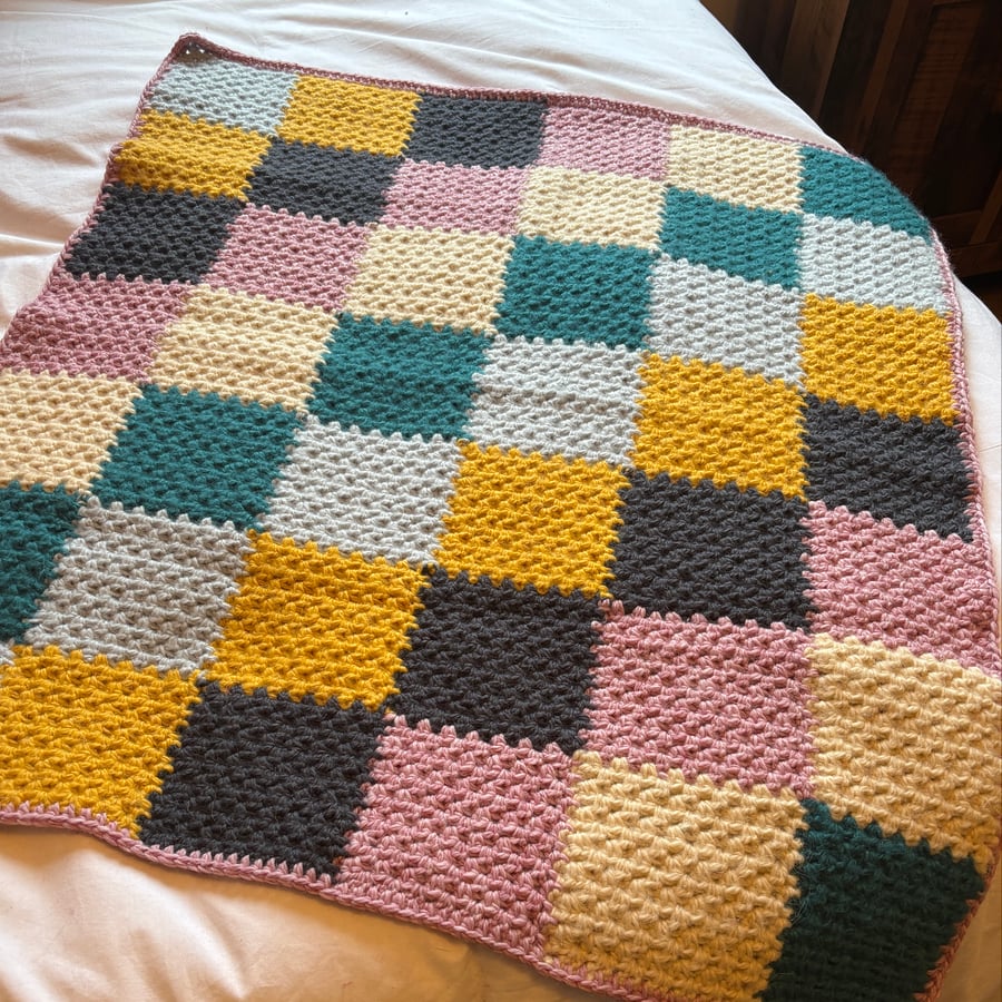 Crocheted patchwork baby blanket