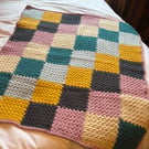 Crocheted patchwork baby blanket