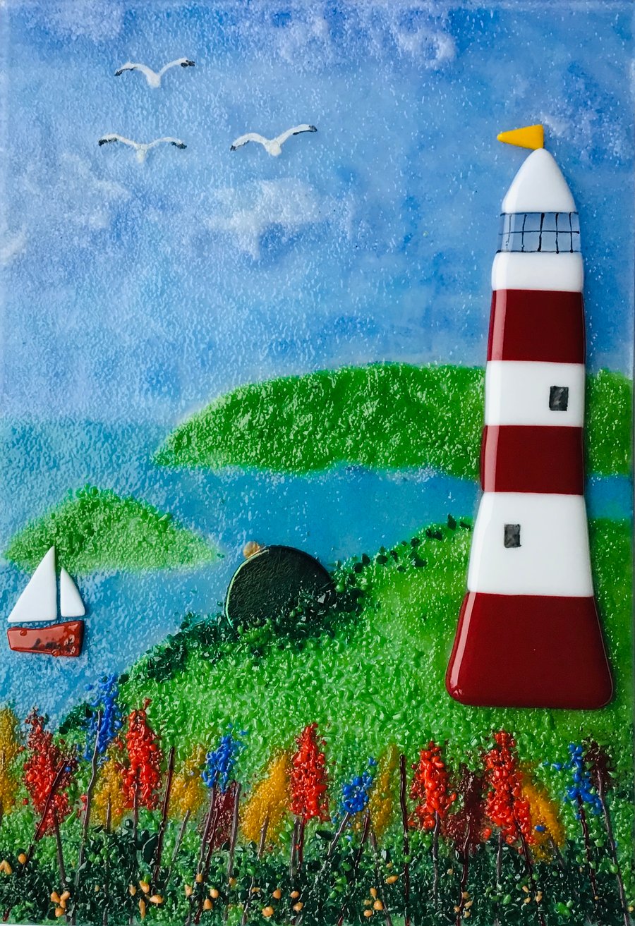 Fused glass lighthouse scene in frame